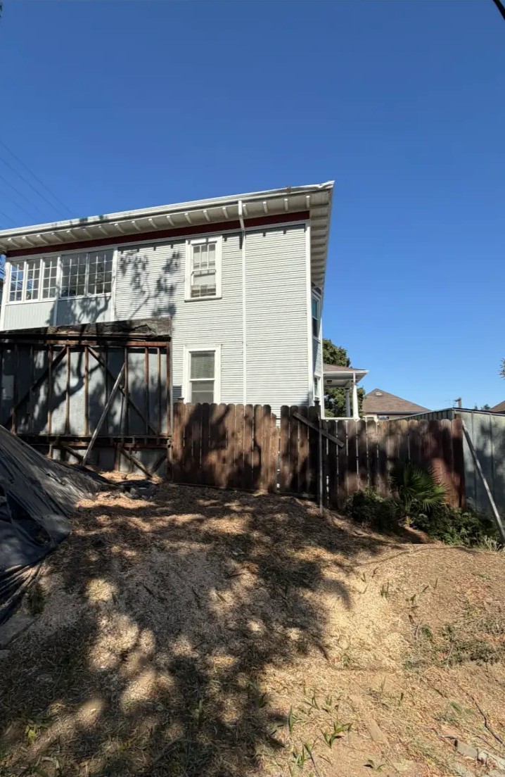 Large tree removed off a two-story home — after Timberland Tree Service